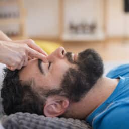 Close-up of a man receiving face massage