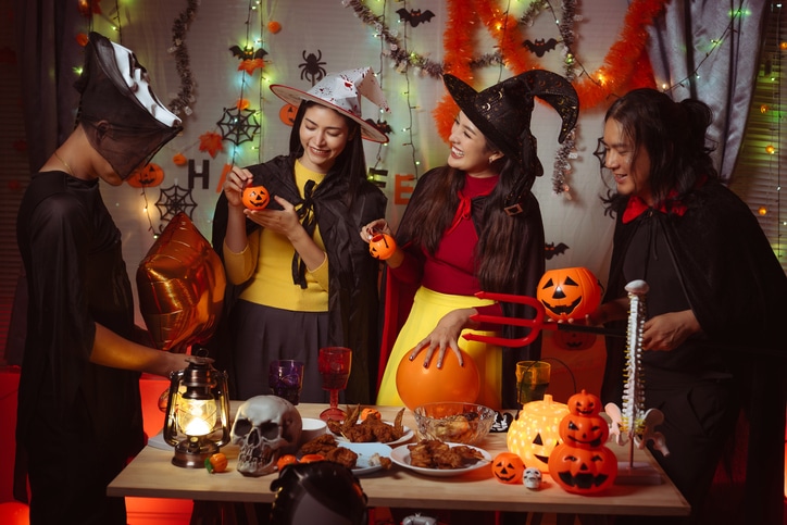 Friends celebrating halloween in costume.